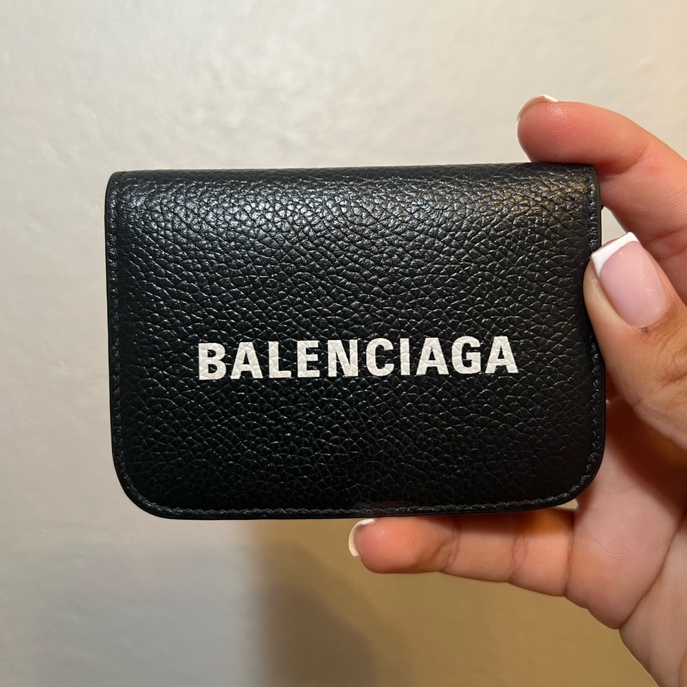Authentic Balenciaga Cash mini wallet on chain. Comes with original packaging.